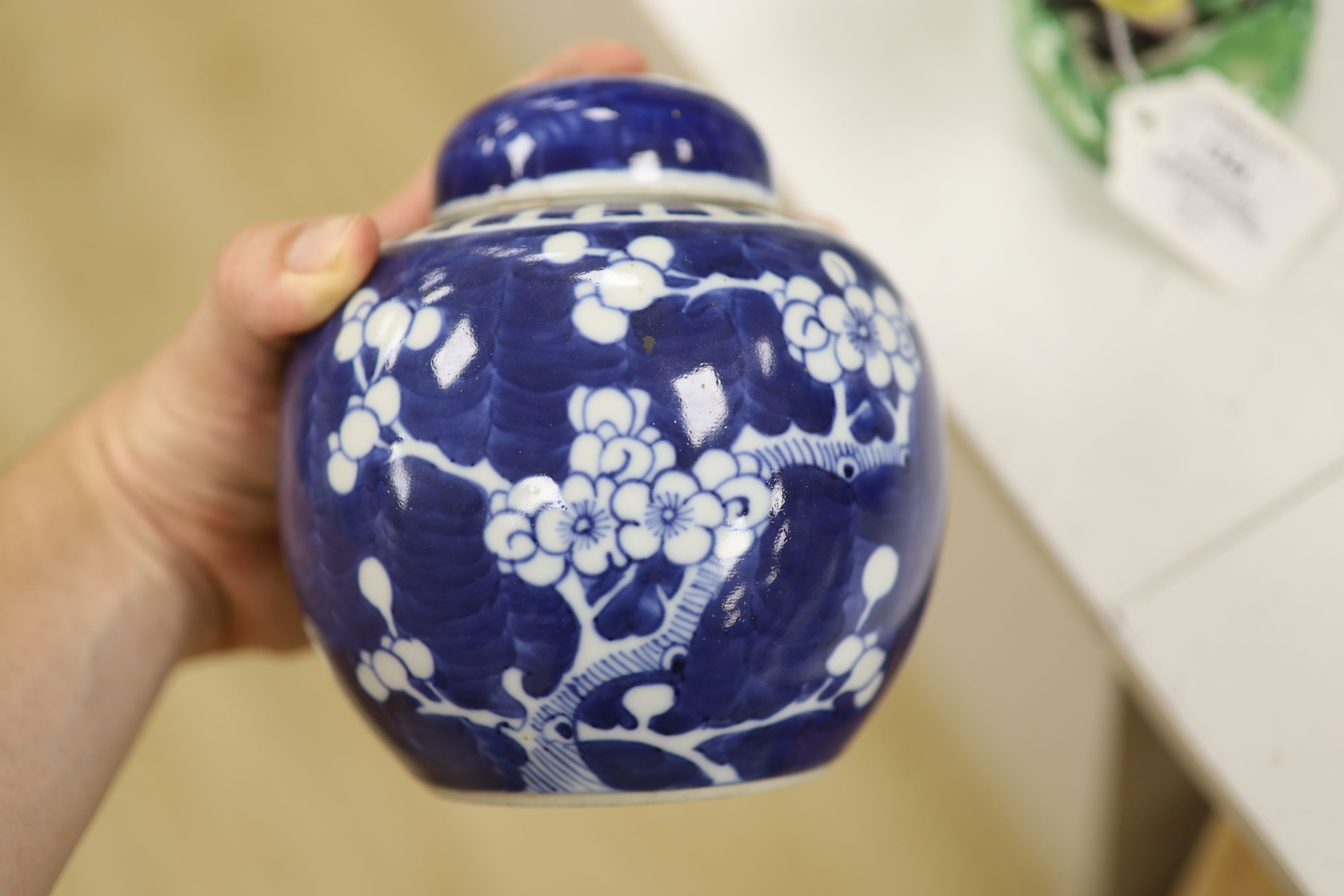 An early 20th century Chinese blue and white ‘prunus’ vase a Republic period millefleur dish, a similar Canton vase and two blue and white jars